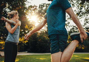 woman and man doing stretching exercise